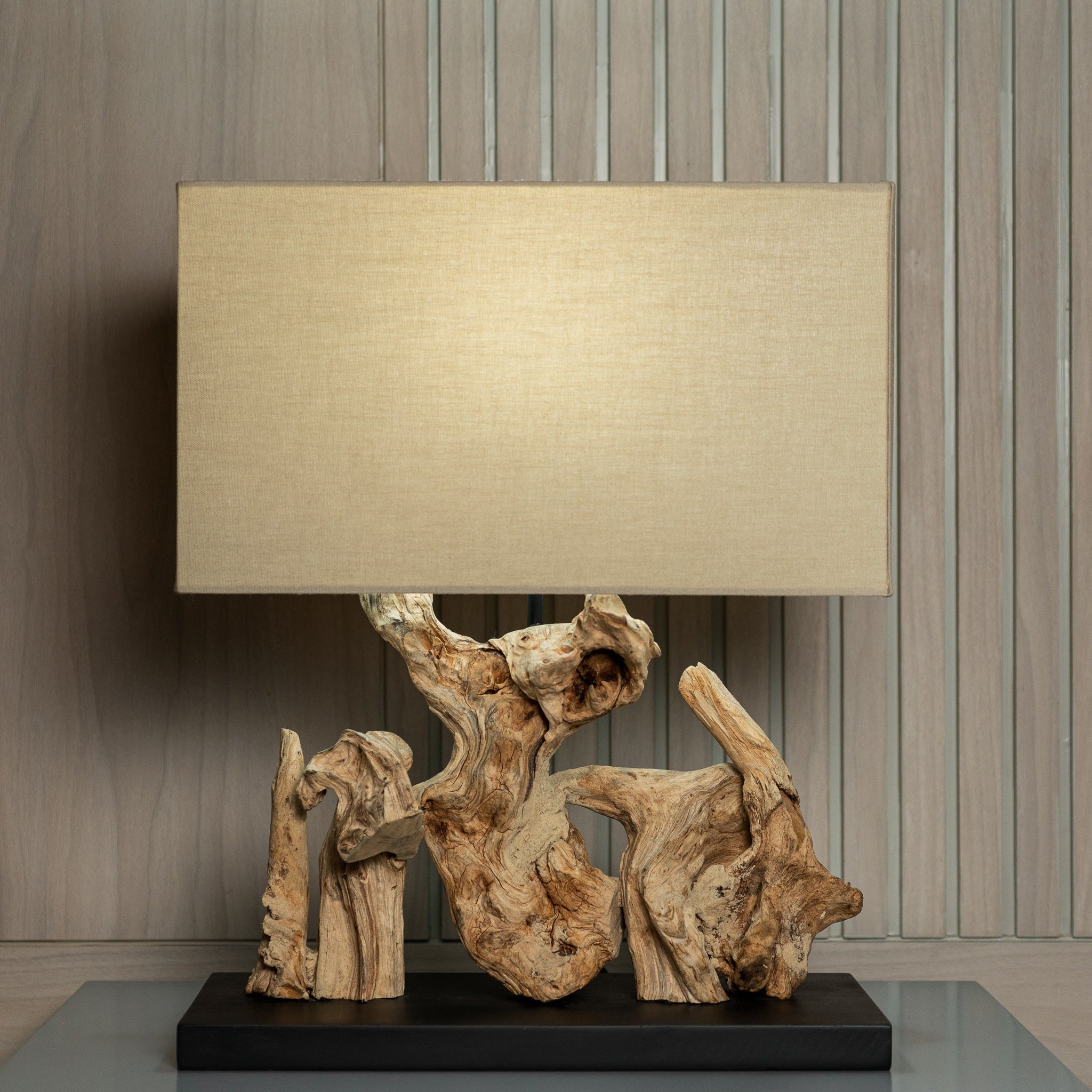 Palmera table lamp with natural driftwood base and linen shade on bedside table, handcrafted organic lighting by Willow Tree Decor